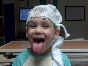 Colten undergoing an EEG