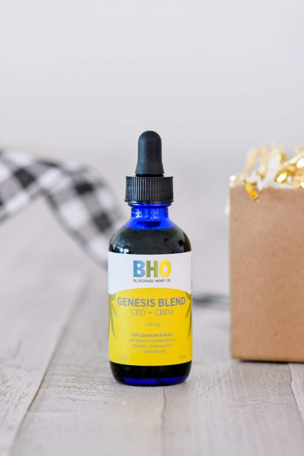 A close-up image of a bottle of Genesis Blend CBD + CBDa oil from Bluegrass Hemp Oil.