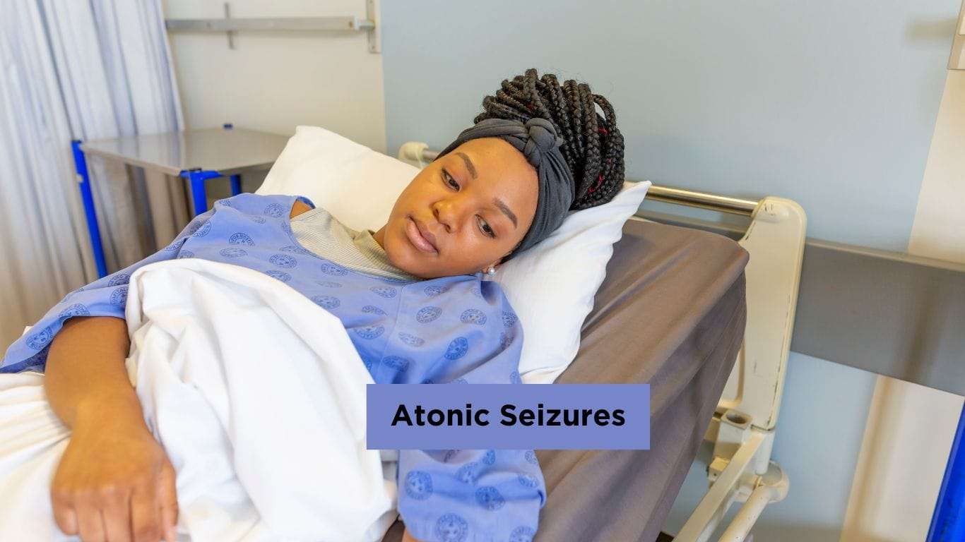 Woman receiving medical care after atonic seizure