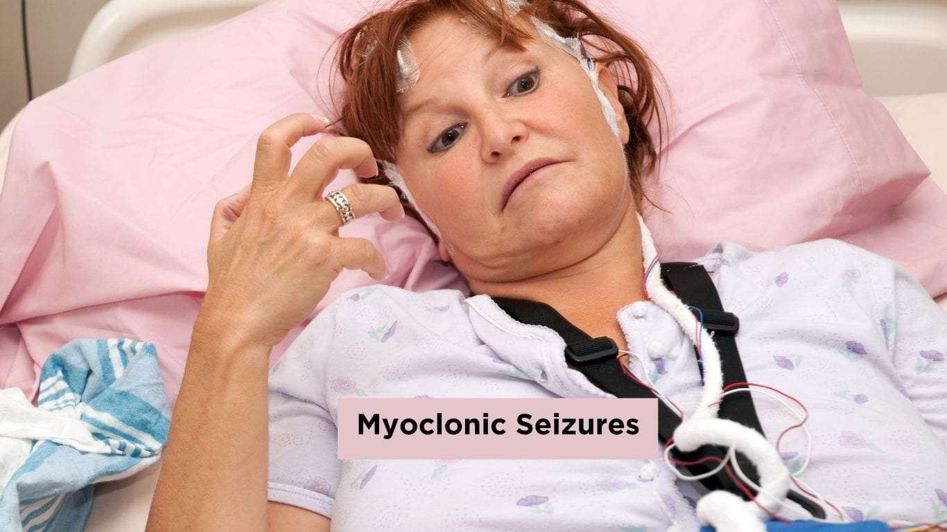 A woman undergoing an EEG test in a hospital bed while experiencing a myoclonic seizure