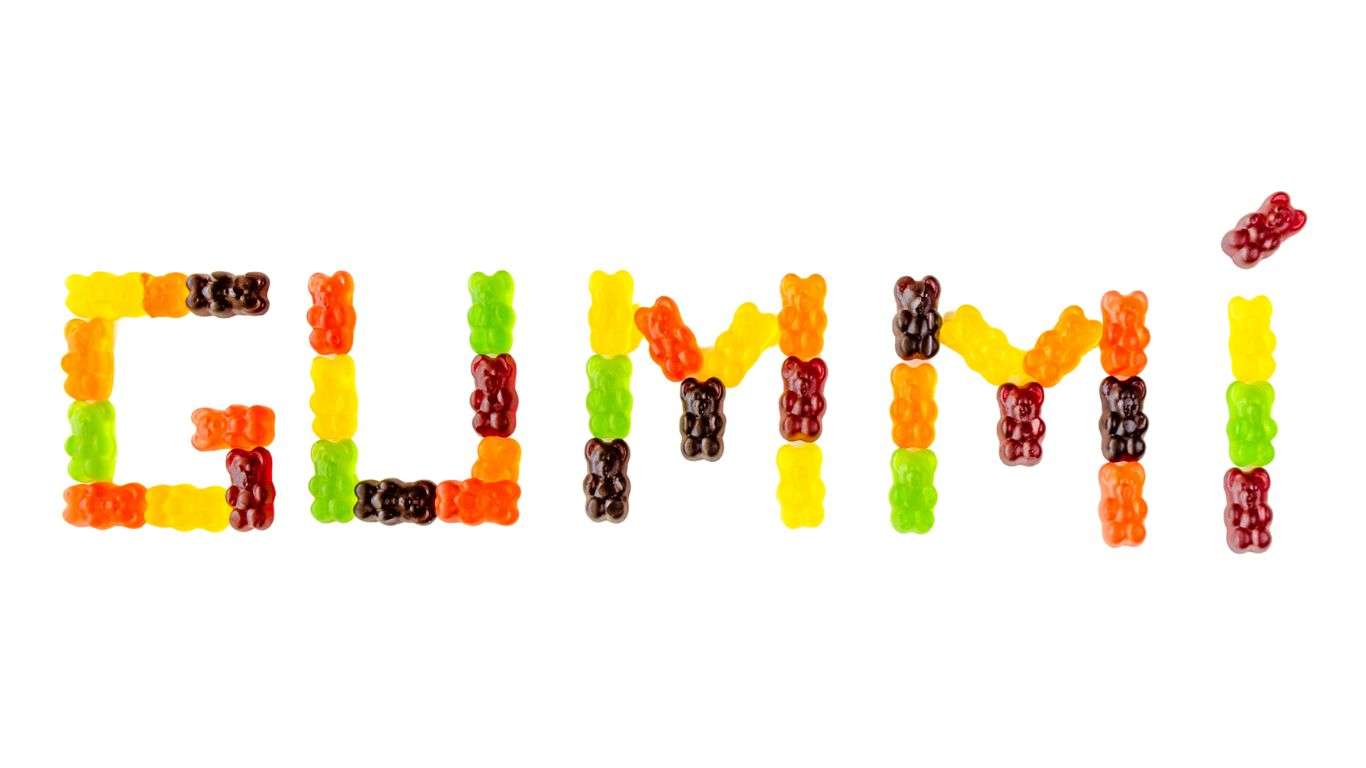 Bold, colorful text spelling "GUMMI" against a simple background.
